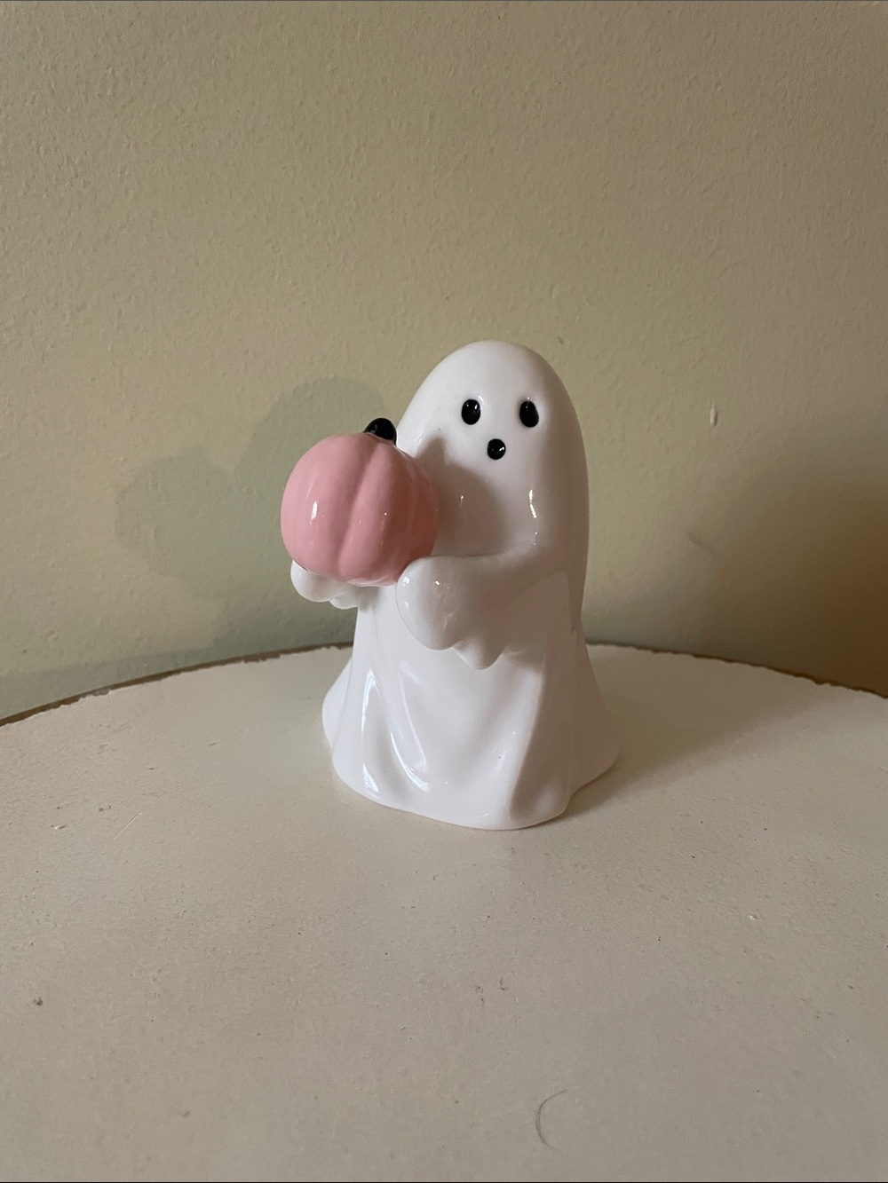 Halloween Ghost holding pink pumpkin